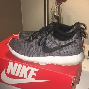 Grey and black nike roshes